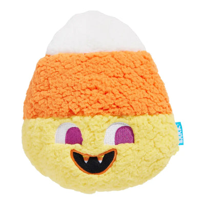 The BARK Candy Cornivore Plush Dog Toy by BARK is a cute candy corn-shaped plush with white, orange, and yellow sections, purple eyes, and a fang—perfect as a Halloween toy for your dog!.