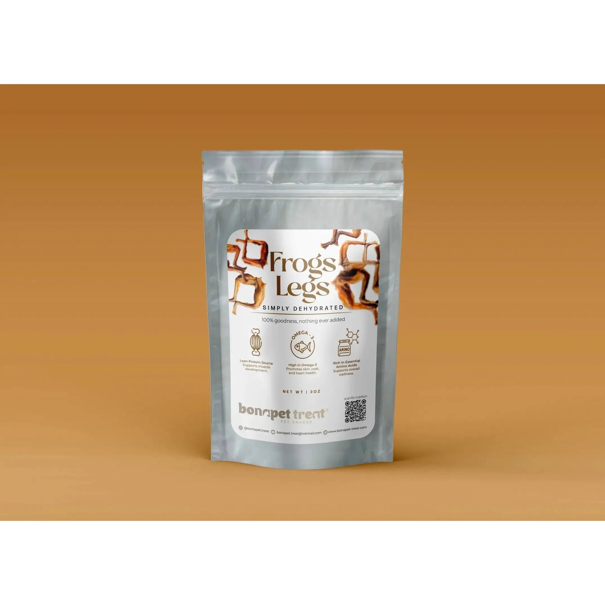 A silver pouch labeled Bonapet All-Natural High-Protein Frog Legs Treat for Pets 3 oz stands upright against a brown background, featuring images of frog legs, product details, and the brand name Bonapet Treat.