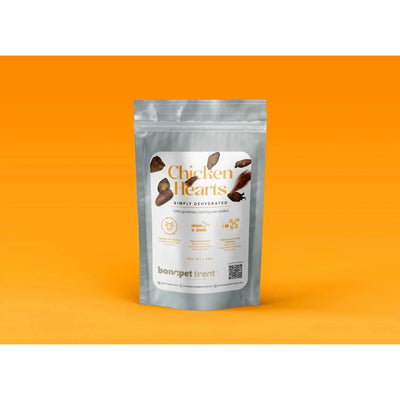 A silver pouch of Bonapet Treats Chicken Hearts - All-Natural High-Protein Treat stands against an orange background. The label shows heart illustrations and promotes this simply dehydrated snack as natural and beneficial for pets health.