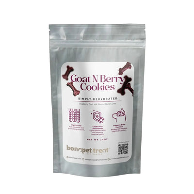A silver resealable pouch labeled “Bonapet Goat N Berry Organic Dog Treats, 4 oz, features bone graphics and icons for high fiber, goat milk, brain health, and blueberry nutrients. Brand: Bonapet Treat.