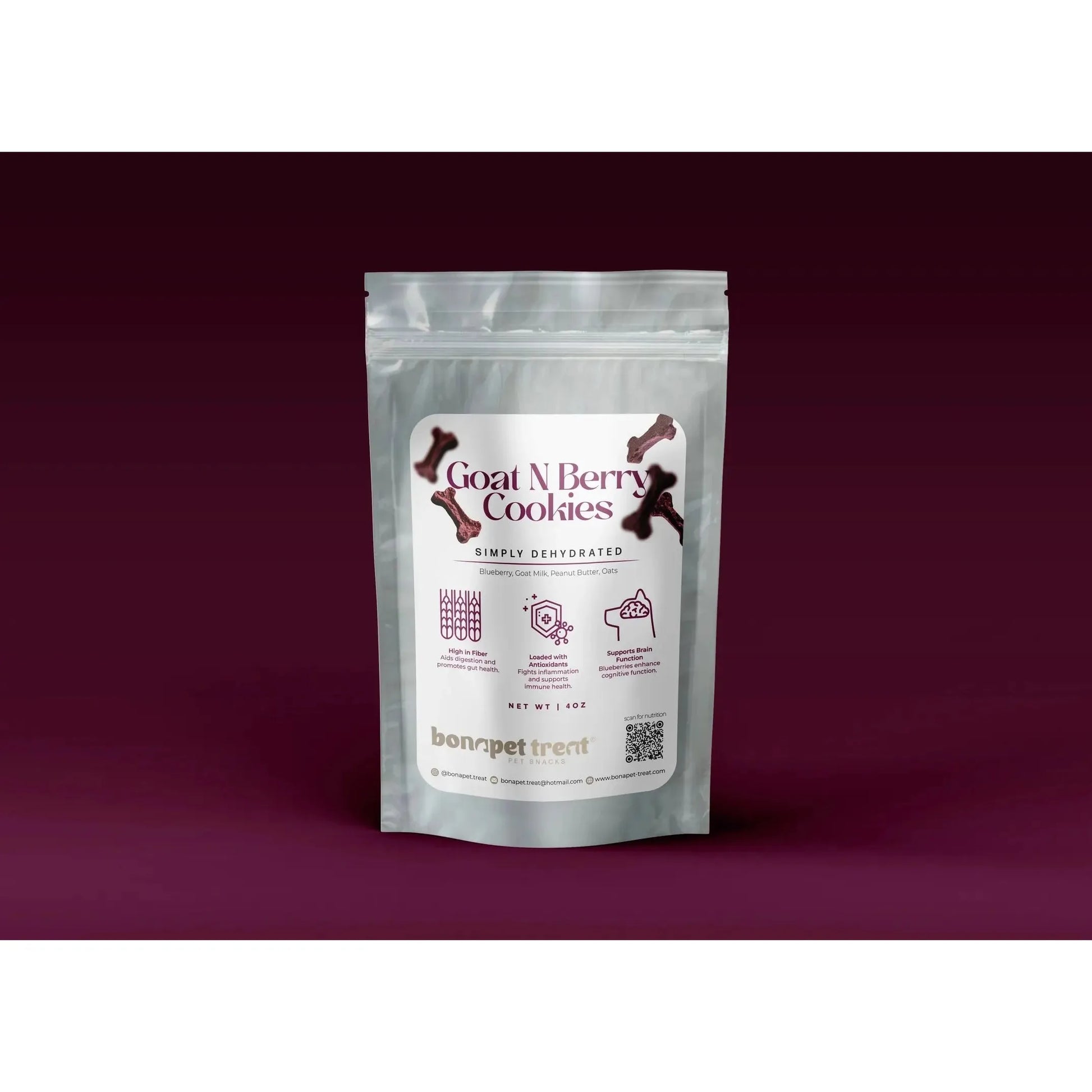 A silver resealable pouch labeled Bonapet Goat N Berry Organic Dog Treats 4 oz, with dog bone graphics, highlights organic dog treats made with goat milk and blueberries, featuring Bonapet Treat branding against a dark maroon background.