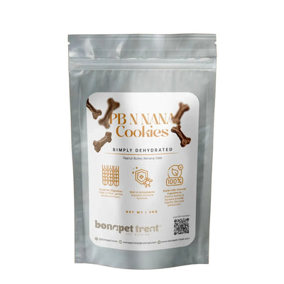 Bonapet Treat Pb N Nana Organic Peanut Butter & Banana Dog Cookies 5 oz come in a clear resealable bag with bone-shaped treats made from oats, offering a healthy snack for dogs and highlighting nutritional benefits on the packaging.
