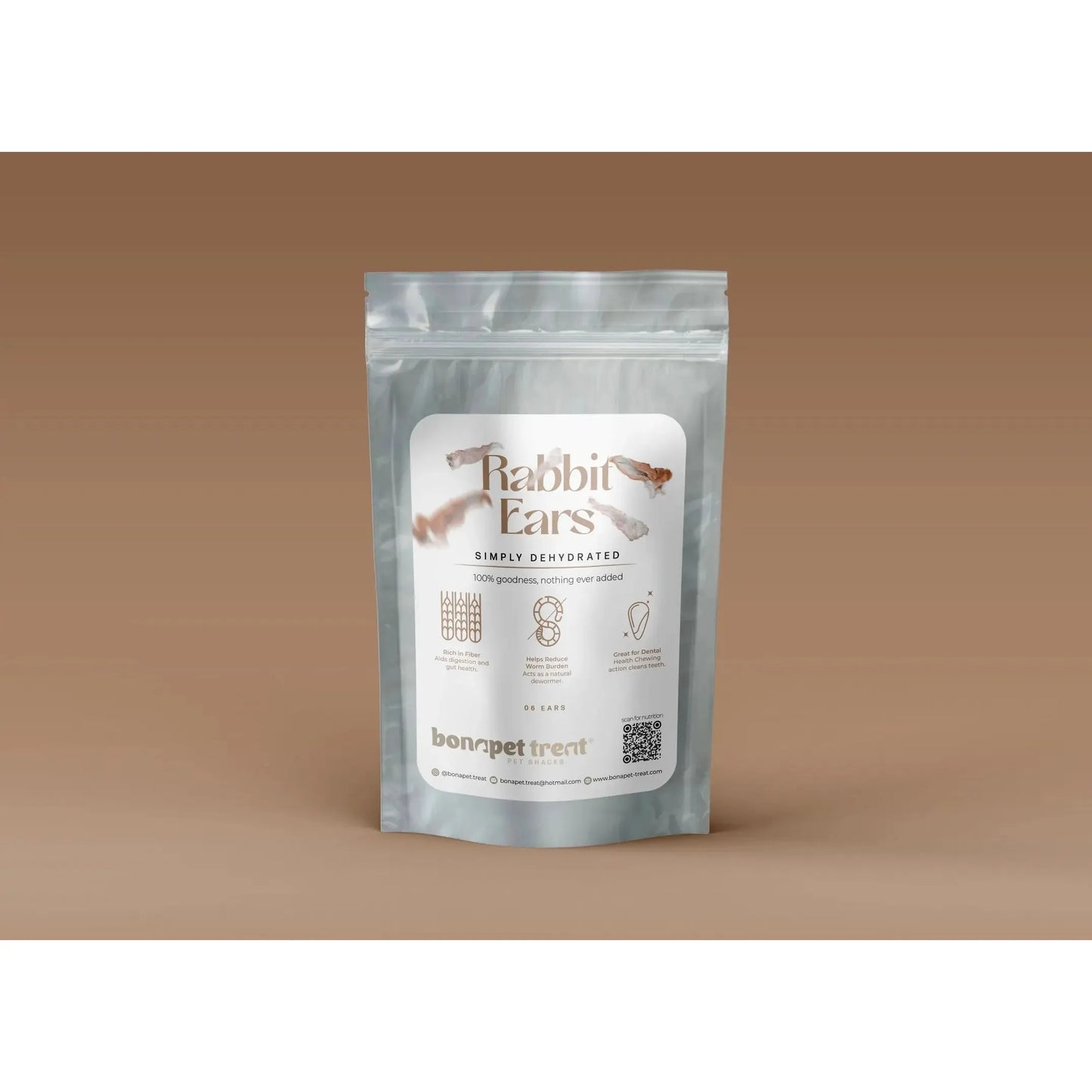 A silver resealable pouch labeled Bonapet Rabbit Ears - High-Protein, Low-Fat Digestive Support Treats from Bonapet Treat, featuring product illustrations, stands upright against a brown gradient background.
