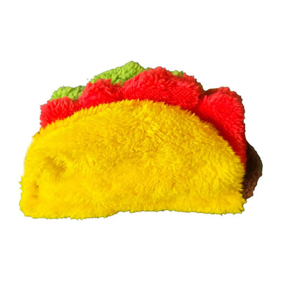 The Cycle Dog Duraplush Eco-Friendly Tough Dog Toy by Cycle Dog is a plush taco-shaped dog toy made from fuzzy recycled materials, featuring a yellow shell, red filling, and green lettuce for sustainable playtime fun.