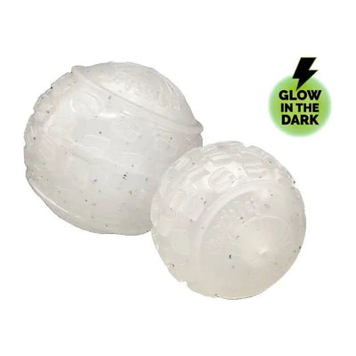 Two translucent, textured Cycle Dog High Roller Dog Balls sit side by side. A green circle with a black lightning bolt and “Glow in the Dark” text in the top right spotlights this eco-friendly toy from Cycle Dog.