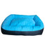 The Cycle Dog Waterproof Barrier Nestle Dog Bed by Cycle Dog is a rectangular blue washable bed with raised cushioned sides, a flat padded center, and a black base and back panel.