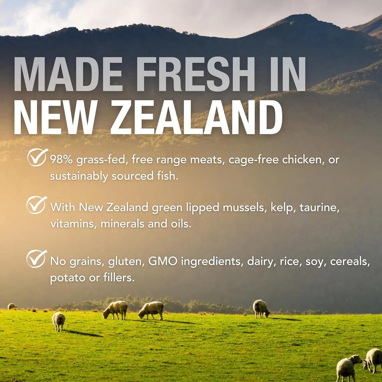 Sheep graze on lush grass before mountains—just like Feline Natural’s Beef & Hoki Feast Grain-Free Canned Cat Food, made in New Zealand with fresh, grass-fed beef and no grains, gluten, fillers, or artificial additives. Pure goodness for your cat.