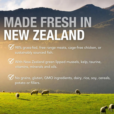 Sheep graze on lush grass before mountains—just like Feline Natural’s Beef & Hoki Feast Grain-Free Canned Cat Food, made in New Zealand with fresh, grass-fed beef and no grains, gluten, fillers, or artificial additives. Pure goodness for your cat.