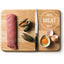 A wooden cutting board holds a raw beef strip, two green mussels, a knife, and a cracked egg. HIGH MEAT DIET is written on the board, ideal inspiration for Feline Natural Lamb Feast Grain-Free Canned Cat Food by Feline Natural.