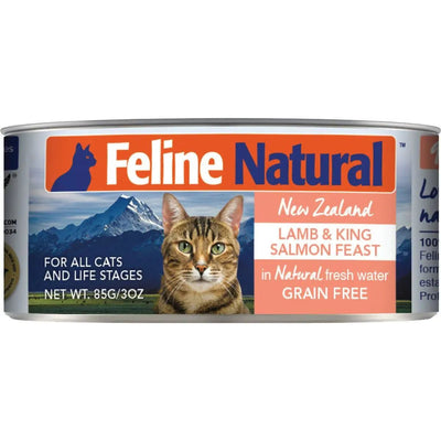 Feline Natural Lamb & King Salmon Feast Grain-Free Canned Cat Food, 85g/3oz, features a tabby cat and mountains on the label. Made in New Zealand, its suitable for all cats.