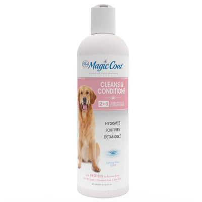 A white 16 oz bottle of Four Paws Magic Coat Cleanse & Conditions 2-in-1 Dog Shampoo and Conditioner features a golden retriever image, pink label, calming water scent, cleans, conditions, hydrates, fortifies & detangles.