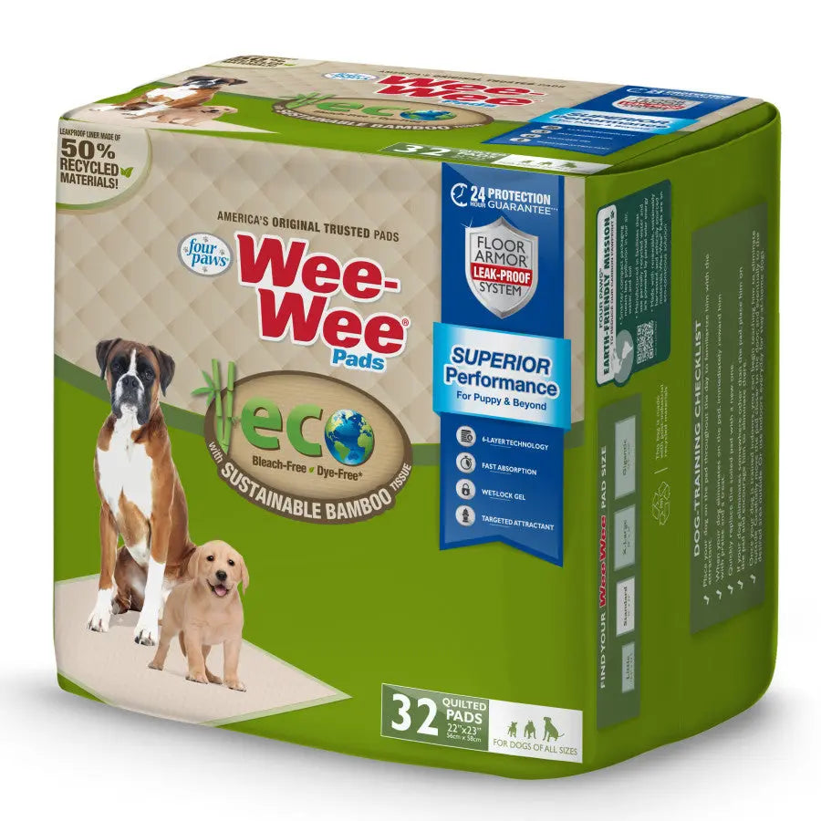A 32-count pack of Four Paws Wee-Wee Superior Performance Eco Bamboo Dog Pee Pads, featuring a Boxer and Labrador puppy on the box. The packaging highlights sustainable bamboo, a leak-proof system, and is suitable for dogs of all sizes.
