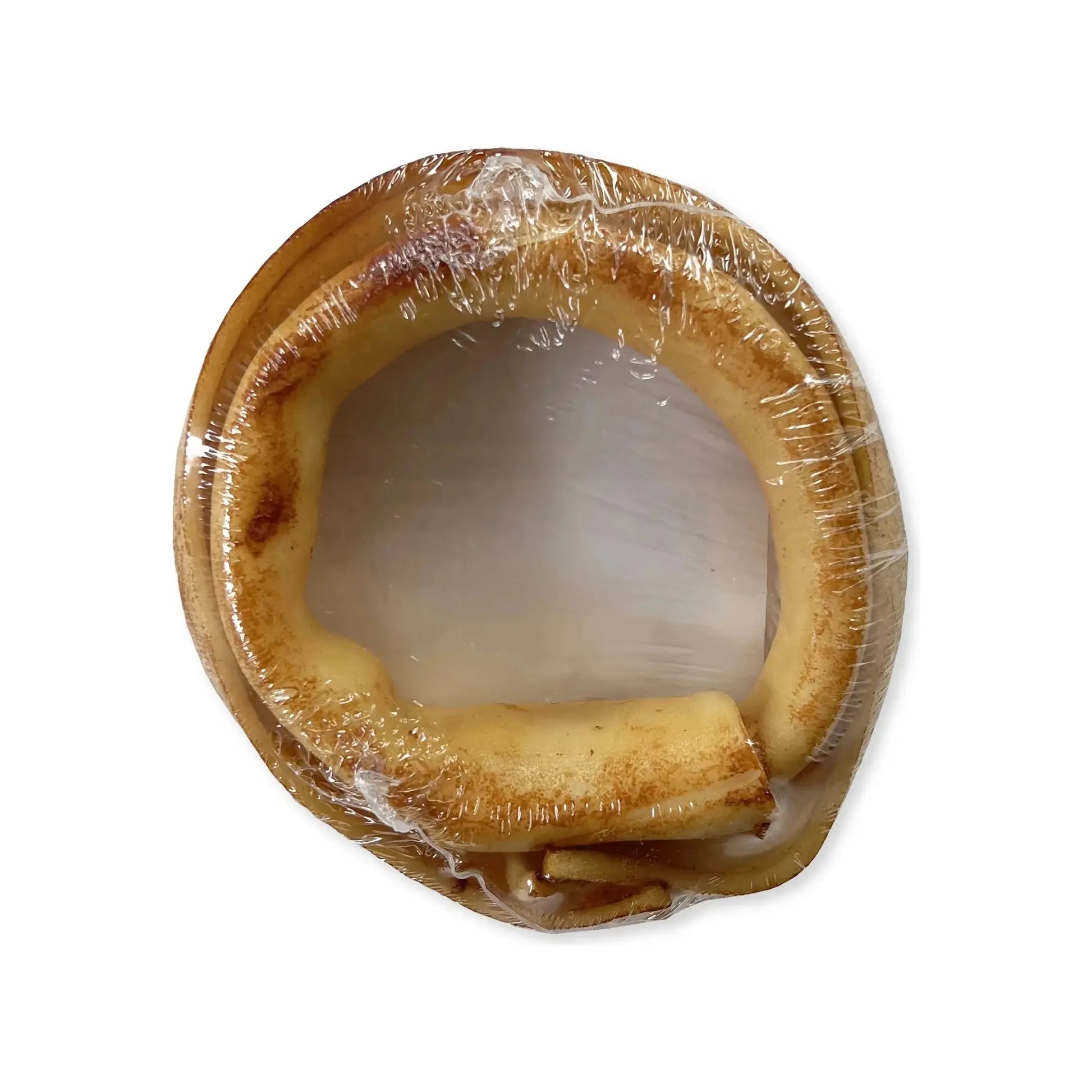 A Frankly Pet Healthy Donut Chew for Dogs by Frankly Pet, a circular rawhide treat infused with natural chicken and wrapped in clear plastic, is shown from above on a white background.