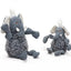 Two HuggleHounds Ellamae Elephant HuggleFleece FlufferKnottie plush dog toys are displayed on a white background. Both have textured grey fabric, white tusks, and fluffy tufts; one is larger and squeaky, while the other is smaller.