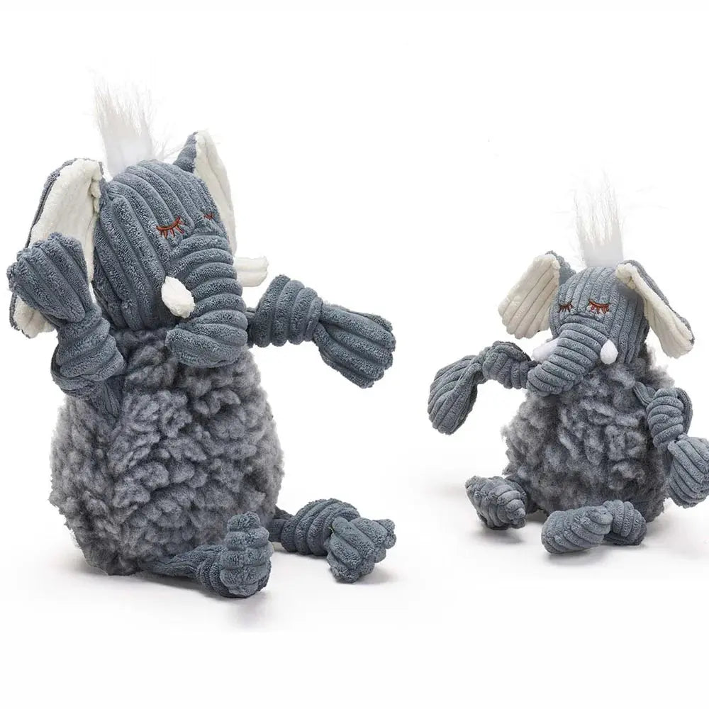 Two HuggleHounds Ellamae Elephant HuggleFleece FlufferKnottie plush dog toys are displayed on a white background. Both have textured grey fabric, white tusks, and fluffy tufts; one is larger and squeaky, while the other is smaller.