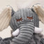 Close-up of the HuggleHounds Ellamae Elephant HuggleFleece FlufferKnottie Plush Dog Toy—a gray, corduroy-textured, washable toy with embroidered eyes, white tusks, floppy cream-lined ears, and a tuft of white hair.
