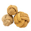 Three HuggleHounds HuggleHide Natural Leather Ball Dog Toys in brown and tan are arranged on a white background. Each durable, knotted ball from HuggleHounds varies in size, making them ideal chew toys for dogs.
