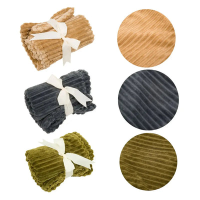 Three HuggleHounds Scout Blankie Double-Sided Plush Dog Blankets in camel, dark gray, and olive green—each rolled with a white ribbon; close-ups highlight the cozy ribbed texture and rich colors of these washable HuggleHounds blankets.