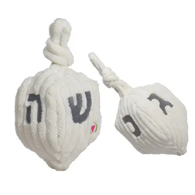 The HuggleHounds Shining Collection Dreidel Durable Plush Dog Toy by HuggleHounds features plush white dreidels with Hebrew letters and knotted tops—an ideal festive dog toy for Hanukkah celebrations.