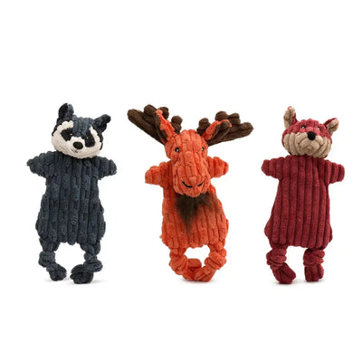 The HuggleHounds Woodland HuggleFlatties Tough Squeaky Small Plush Dog Toys 3pk features a raccoon, moose, and fox, made from durable ribbed fabric. All three plush dog toys stand upright against a white background.