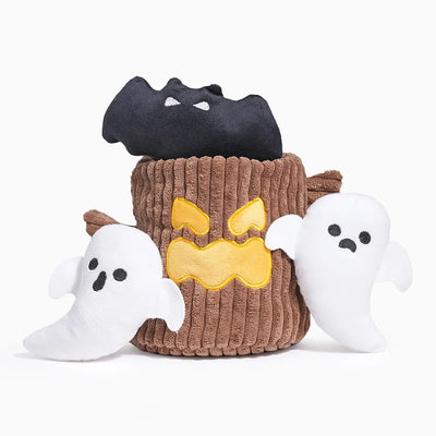 The Hugsmart Pet Howloween Night Haunted Tree Interactive Dog Toy by Hugsmart Pet features a plush brown basket with a yellow angry face, holding a black bat and two white ghosts—perfect for festive Halloween playtime.