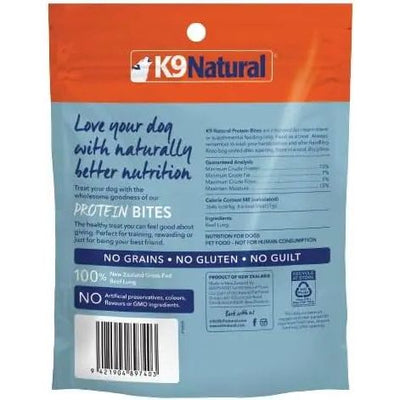 Back of a K9 Natural Beef Lung Protein Bites Air-Dried Dog Treats 2.1oz package by K9 Natural. Made with 100% grass-fed New Zealand beef, grain-free, gluten-free, no artificial preservatives. Ingredients and nutrition info included.