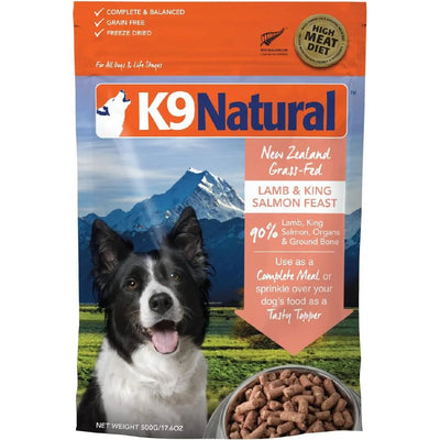 A bag of K9 Natural Lamb & King Salmon Grain-Free Freeze-Dried Dog Food, featuring a Border Collie, a bowl, mountain scenery, and benefits like omega-3s, grass-fed lamb, and 90% lamb, king salmon, organs & ground bone.