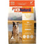 A bag of K9 Natural New Zealand Chicken Feast Grain-Free Freeze-Dried Dog Food shows a happy dog outdoors with mountains and a lake, highlighting 94% cage-free chicken & organs, grain-free recipe, and freeze-dried natural goodness.