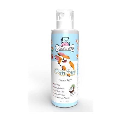 The Kenchii Pets Happy Puppy 8oz Grooming Spray features a cartoon corgi, coconut graphic, and light blue and white label. It detangles coats and comes in an 8oz bottle with a clear spray nozzle. Brand: Kenchii.