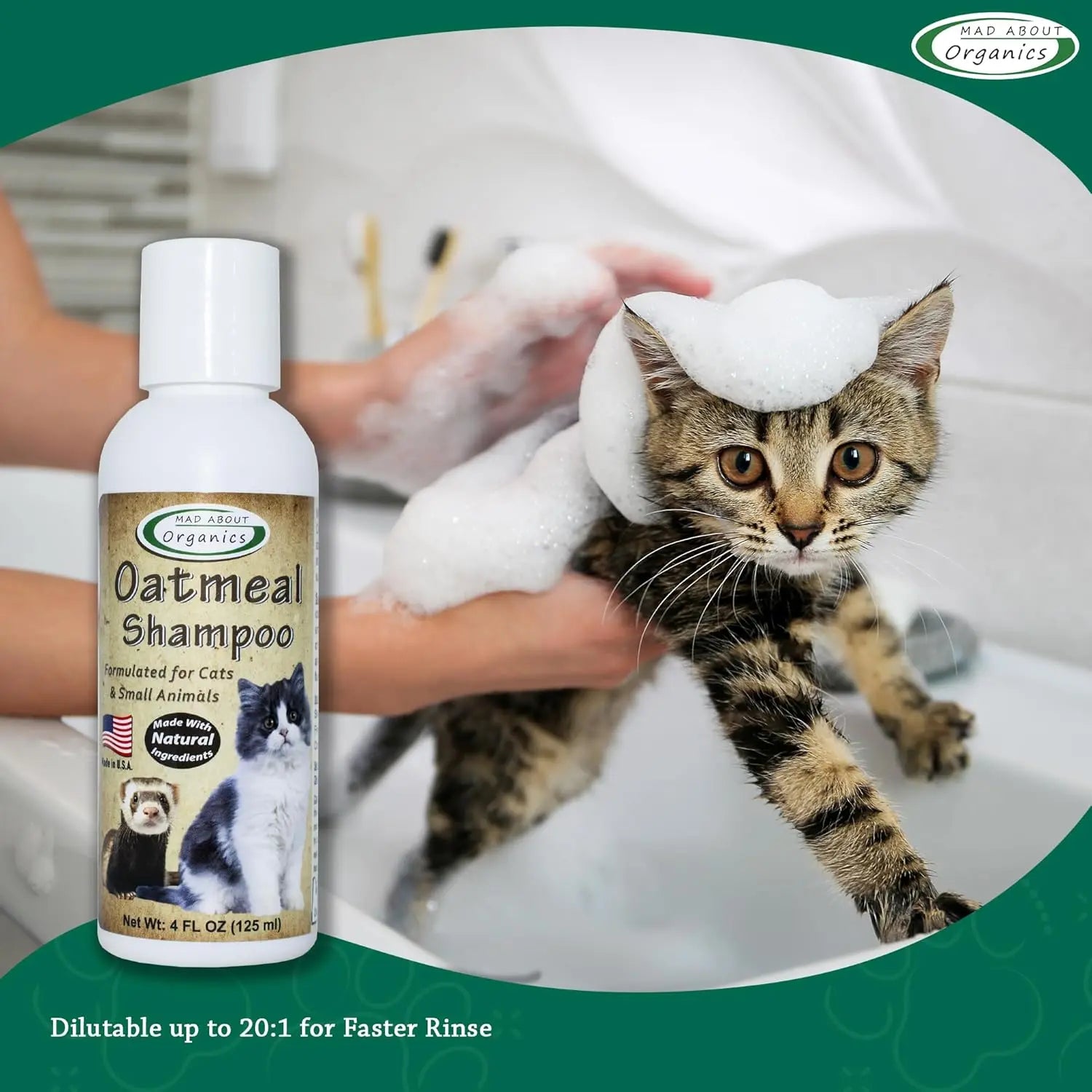 A person bathes a surprised cat in a sink, white foam from Mad About Organics Cat Oatmeal Shampoo on its head. In front is a 4oz bottle labeled Gentle Care for Happy Skin by Mad About Organics.