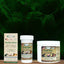 Three jars of Mad About Organics Herbal Salve, featuring green labels with an American flag logo, are shown among ferns. The packaging emphasizes its natural, alcohol-free formula for skin nourishment and safe use.