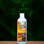 A 16oz bottle of Mad About Organics Tahitian Sunset Dog Shampoo features a dog on the label set against vibrant green fern leaves. This organic shampoo is designed for sensitive skin and safe cleansing.