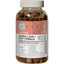 A clear bottle labeled MicrocynAH MICRO Cat Skin & Coat Hairball Soft Chews 120g holds brown chews. The label showcases cat skin health, shiny coat, and hairball support with leaf and cat illustrations. Brand: MicrocynAH.