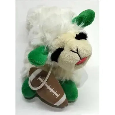 The Multipet Football Edition Lamb Chop Plush Dog Toy, 6.5, features a sheep with green ears and feet, black eyebrows, pink tongue, and holds a plush football—a soft, cuddly toy from Multipet.