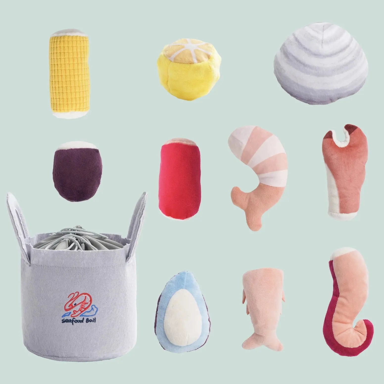The Nocciola 10-Piece Seafood Boil Dog Toy Set features plush seafood-shaped toys with squeakers and crinkle sounds, plus a cute storage basket labeled Seafood Boil. Perfect for interactive play and adorable on display.