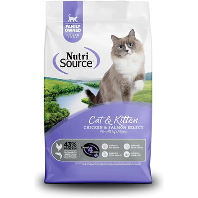 A bag of NutriSource Grain Free Chicken & Salmon Select Cat & Kitten Dry Cat Food, showing a gray and white blue-eyed cat by a river and grass, highlights digestive health benefits and high protein content.