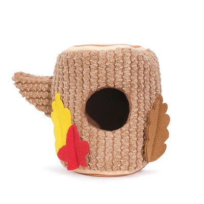The Hugsmart Pet Oriland Autumn Woofs Acorn Tree Interactive Dog Toy is a plush, brown, knit-textured stump with a round opening, red, yellow, and brown felt leaves, plus a small side branch.