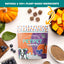 A bag of PETIPET Pumpkin Fruit + Veggie Bites Gluten-Free Adult Soft & Chewy Dog Treats 5oz sits on a white surface with blueberries, pumpkin, sweet potato pieces, and grains. A banner above reads: Natural, 100% Plant-Based, Vegan, Human-Grade Ingredients.