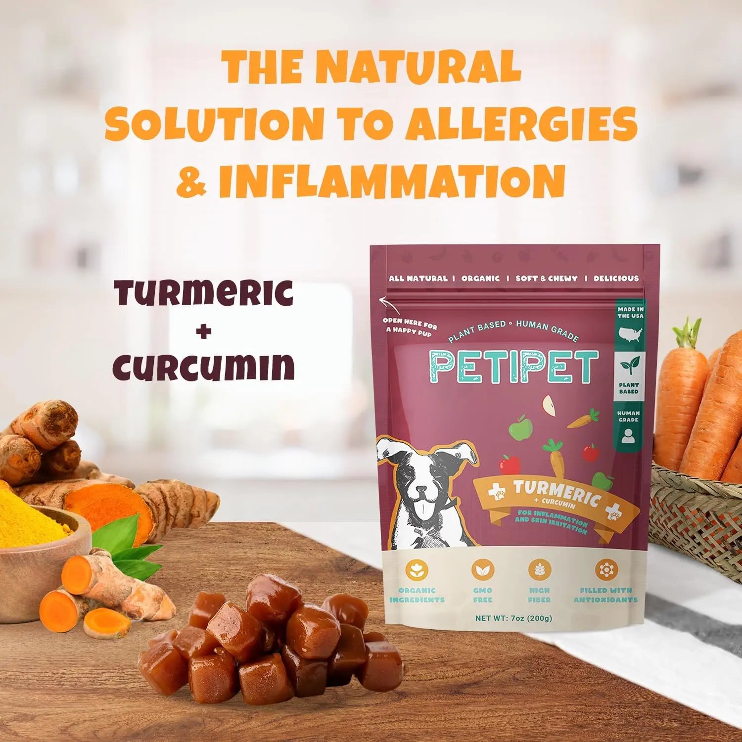 A 7oz bag of PETIPET Turmeric Bites + Curcumin Apple & Carrot Flavored Soft Chew Anti-Inflammatory Supplement for Dogs is displayed with turmeric roots, powder, caramel cubes, carrots, and greens. “The natural anti-inflammatory solution.”.