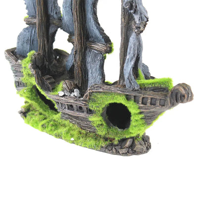 The Penn Plax Pirate Ship with Moss Aquatic Decor is a non-toxic, realistic wooden shipwreck model with green moss, openings, and worn wood and stone textures. Perfect as a pirate ship decor for your freshwater tank.
