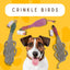 A happy dog sits in front of three colorful, rope-like Pet-Safe Bird Toys for Dogs Made from Recycled Materials by Advance Pet Products, set against a yellow background with paw prints.