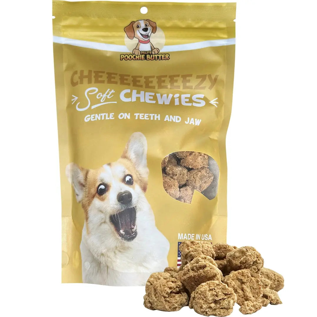 A yellow bag of Poochie Butter Cheezy Soft Chewy Dog Treats features a smiling corgi and crumbly treats. Made with premium ingredients, these treats deliver a tasty white cheddar flavor dogs will love.