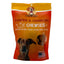 A 12oz bag of Poochie Butter Dillys Pumpkin Soft & Chewy Dog Treats with orange packaging, a dog photo, a clear window displaying the treats, and labels showing limited edition, fresh baked, and made in the USA.