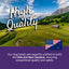 A scenic landscape with rolling green hills, trees, and mountains features “High Quality” text. Below, text states Real Meat® Lamb & Lamb Liver Jerky Dog Treats are made in the USA and New Zealand using real meat, with both countries’ flags shown.