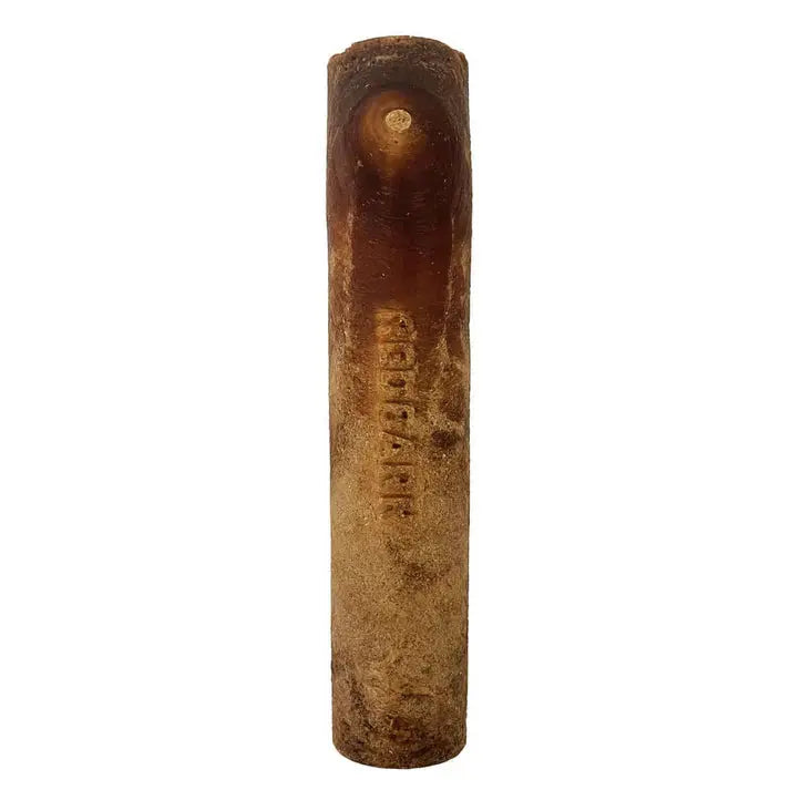 A cylindrical, weathered dog chew engraved with Redbarn stands upright; made of wood, the Redbarn Hickory BBQ Dur-A-Bulls Stick is a healthy, natural rawhide alternative for dogs showing signs of age and use.