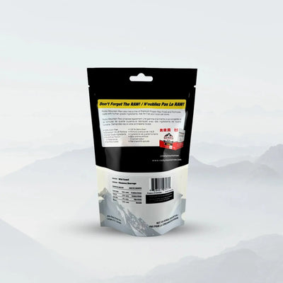 A black and white Rocky Mountain Raw Premium Allergy-Friendly Camel Jerky for Dogs 1.76 oz pouch stands upright, showing text and a barcode on the back against a light background with misty mountain silhouettes—ideal for dogs needing allergy-friendly protein.