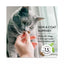 A person holds two star-shaped Shameless Pets Fintastic Catnip Crunchy Cat Treats 2.5oz near a gray cat’s nose. Text reads, Skin & coat support—made with omega 3 & 6 for a healthy coat! Only 1.5 calories per treat.