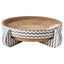 The Spot Nest Cat Scratcher by Spot features corrugated cardboard with gray and white zigzag-patterned sides and legs. Elevated and round, it promotes nail health and includes a small white toy mouse on the scratcher surface.