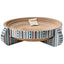 The Spot Nest Cat Scratcher by Spot is a round, layered cardboard scratcher with a colorful geometric pattern and four legs. It comes with a small bag of catnip in the center to encourage play and help maintain your cat’s nail health.