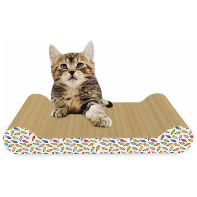 A brown and white tabby kitten rests on the ThoozyPet Paw Lounge Cat Scratcher by ThoozyPet, an eco-friendly scratcher made from recycled cardboard with colorful leaf patterns, gazing up with alert eyes.